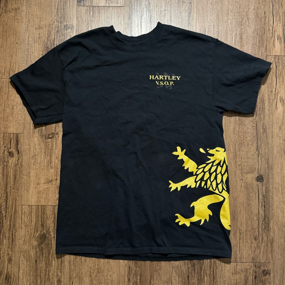 Hartley VSOP y2k tee with a yellow lion design on the front side and back AOP